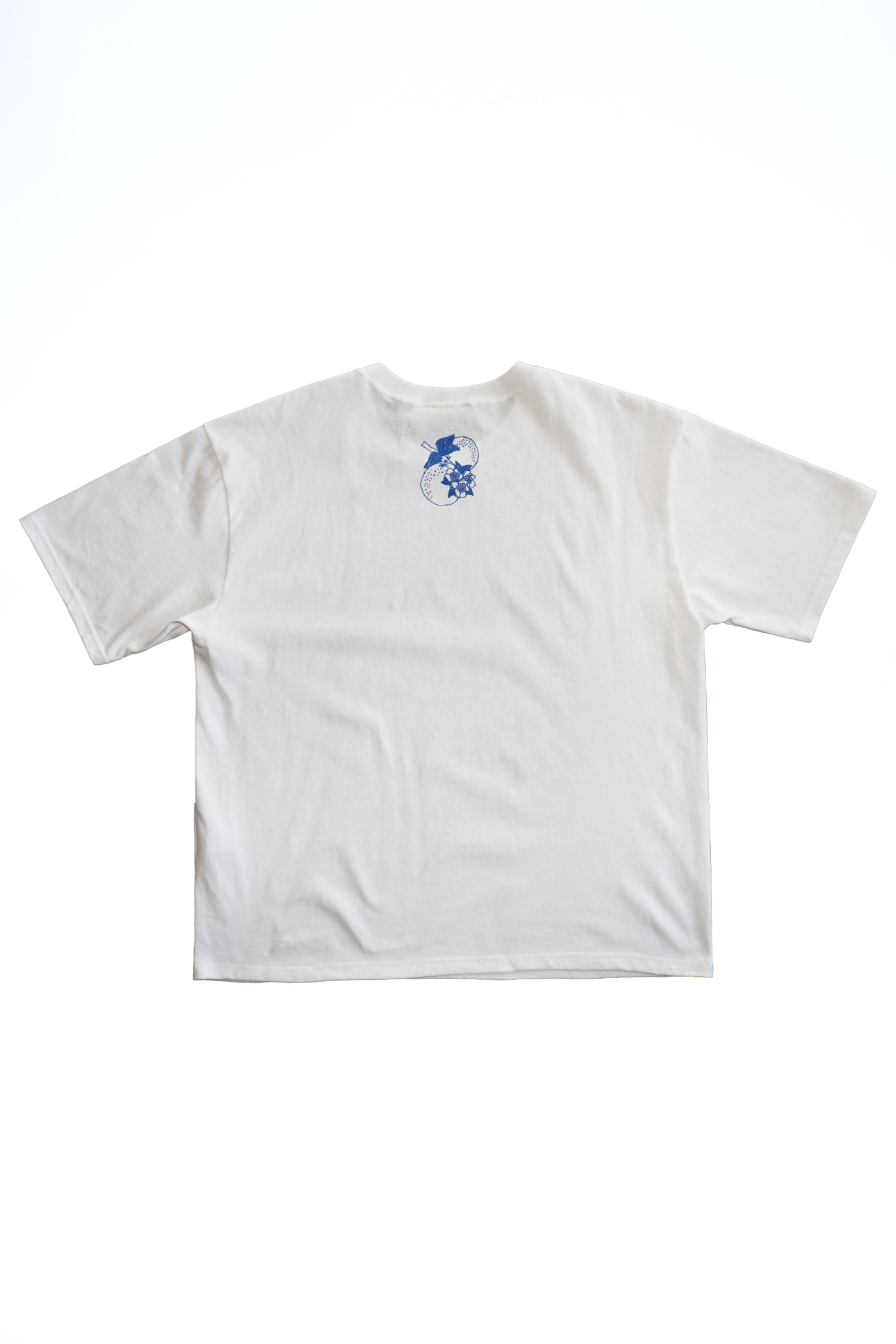 White t-shirt with a small blue graphic on the chest against a white background