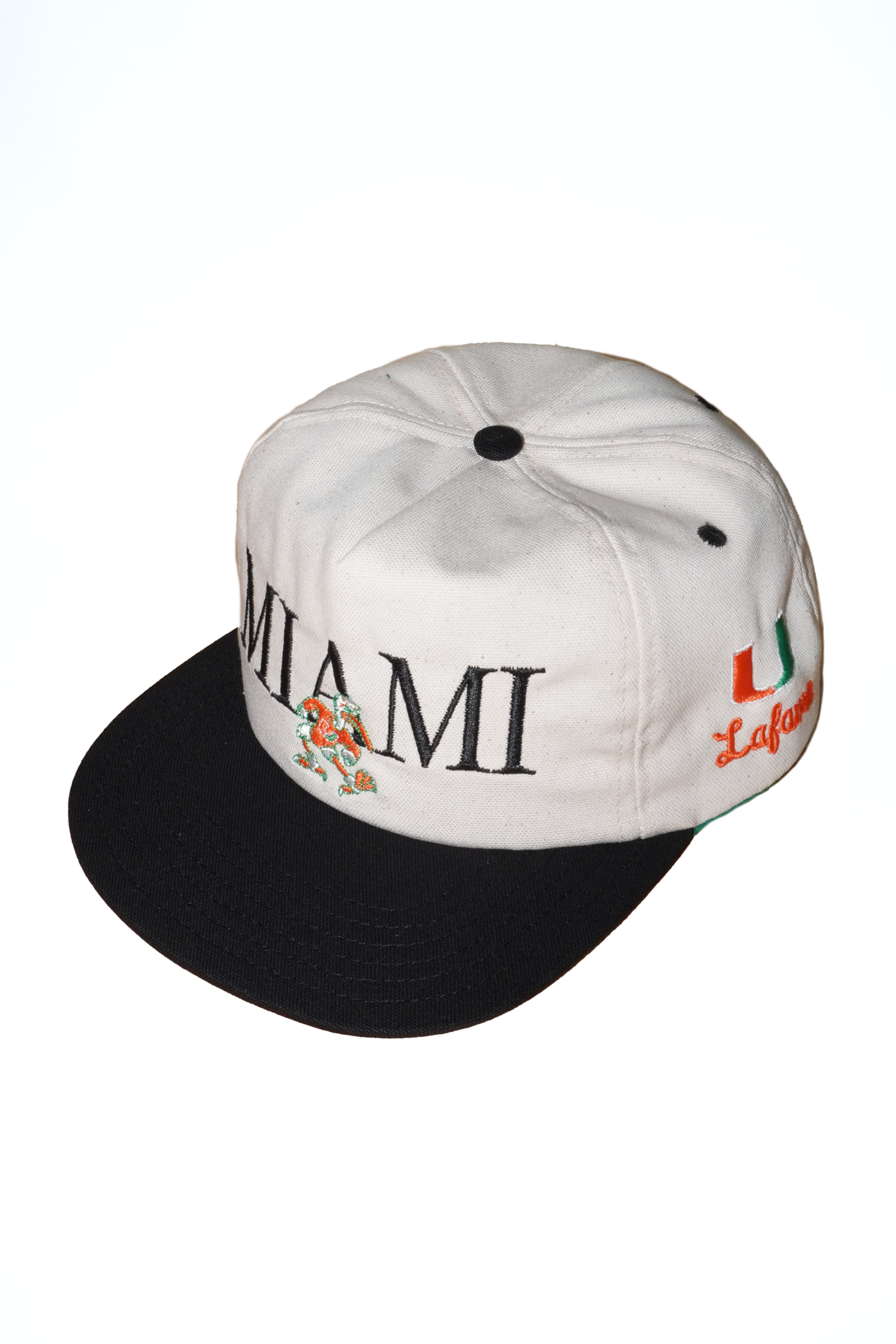 White and black cap with 'Miami' and floral design on a white background