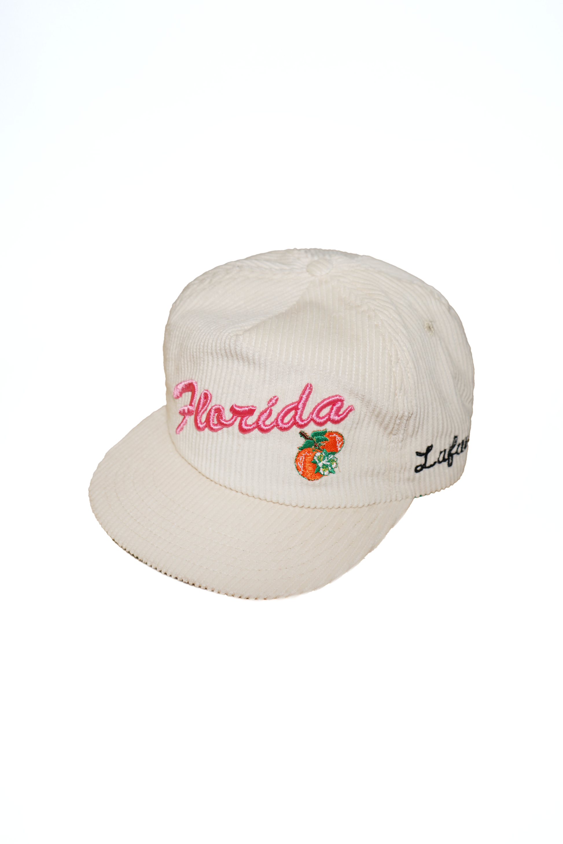 Beige cap with 'Florida' and peach design on a white background