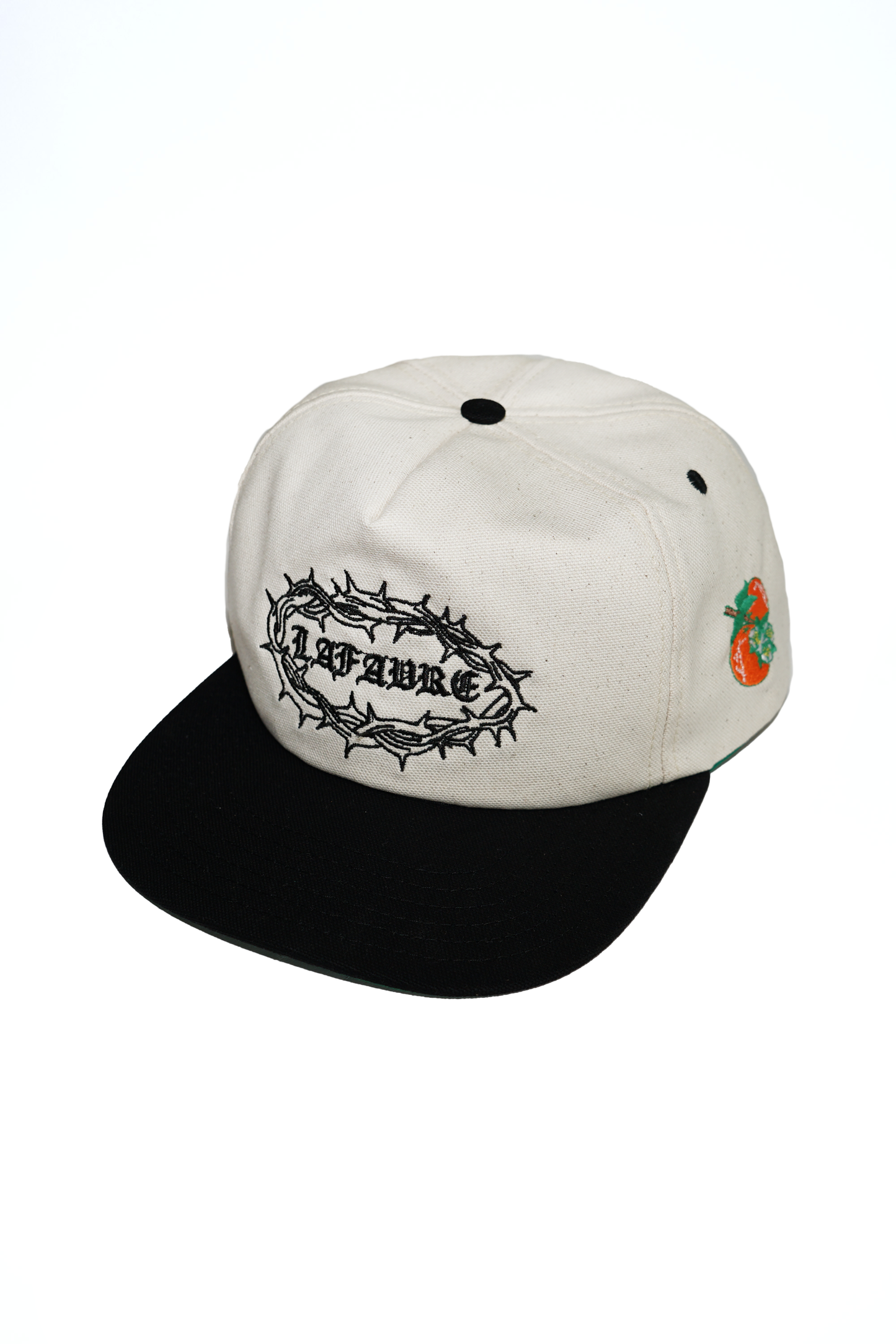 White and black cap with branding on a white background
