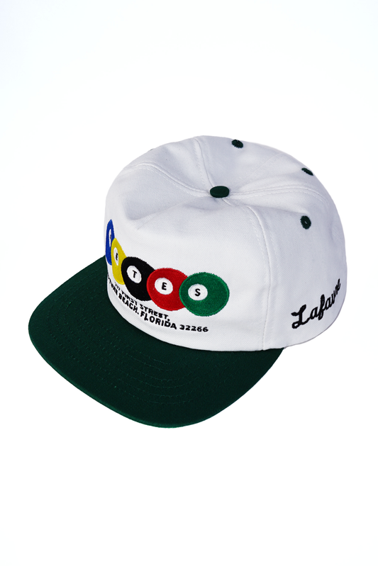 White cap with black brim and colorful billiards ball design on a white background