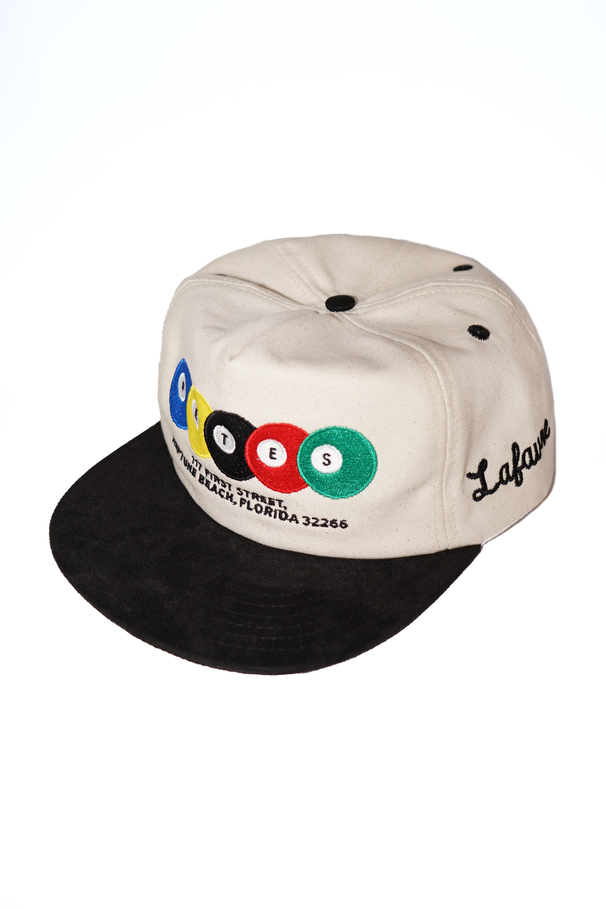 White and black cap with colorful logo and text on a white background